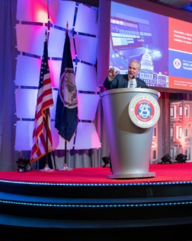 a person speaking at a podium